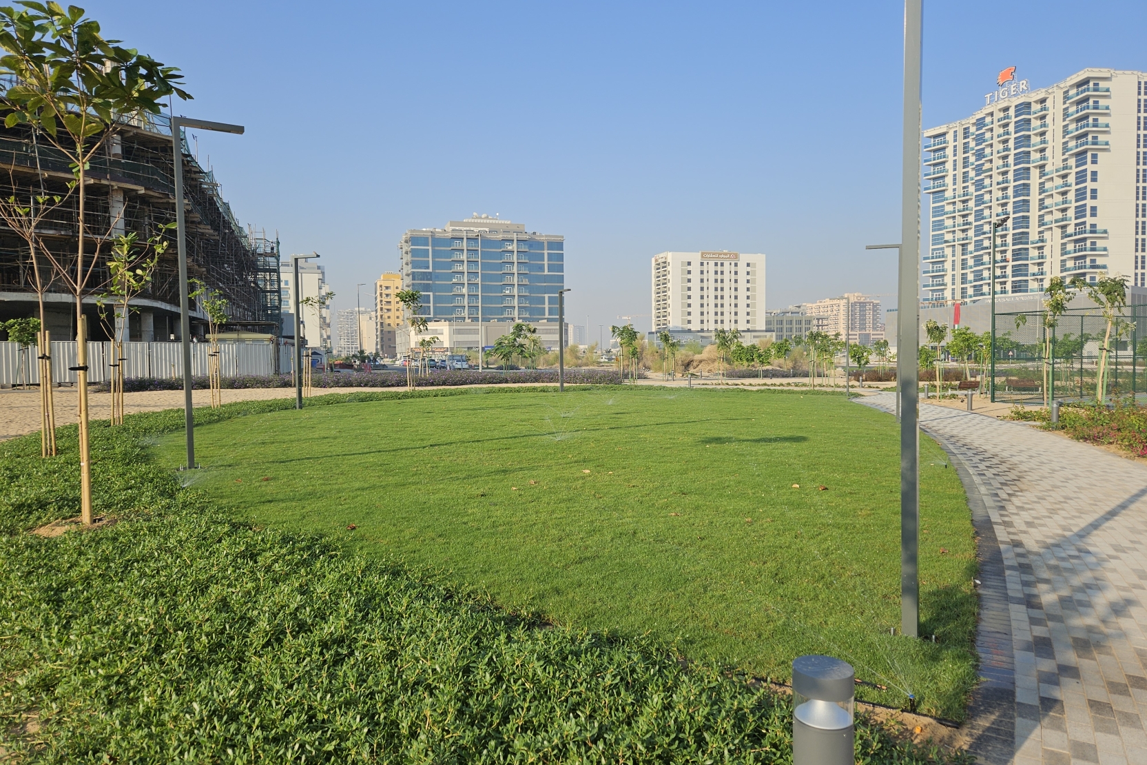 Day-to-day living feels effortless in Majan. Planned as a mid-rise, urban-suburban neighborhood, Majan combines contemporary apartment towers with ground-floor retail, pocket parks and essential services, so your supermarket, pharmacy, salon and casual dining are just downstairs. Many residences in Majan deliver modern finishes plus on-site gyms and pools, wide streets mean parking is easy, and the calm, residential vibe is a refreshing contrast to busier coastal districts. Public transport is still developing, but the community’s grid layout and instant access to E311 make car and ride-hailing journeys simple—delivering the convenience you want without the prime-location price tag.